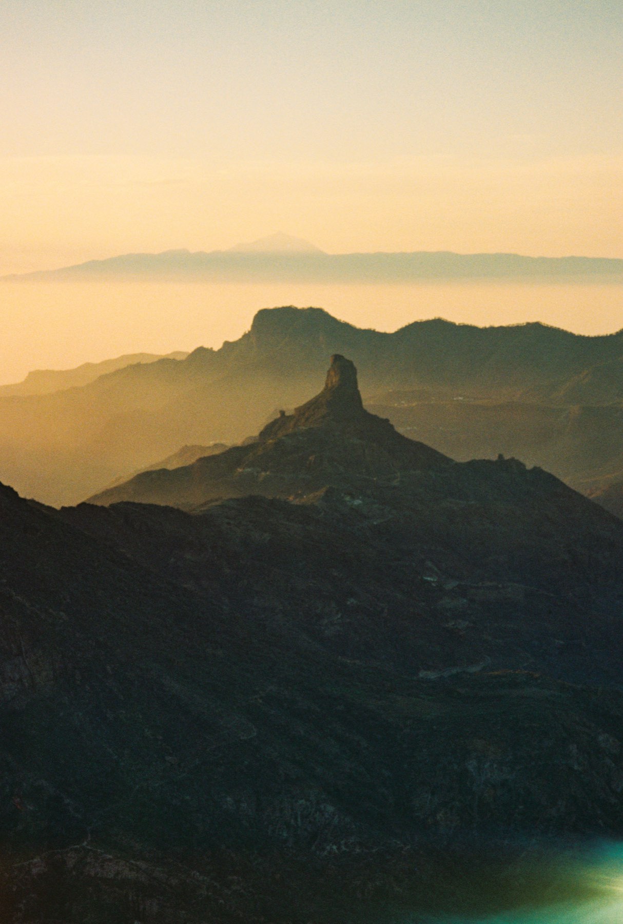 Rock pinnacle on a mountain ridge at golden hour